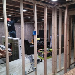 Ziptite Handyman framing out a basement for additional living space